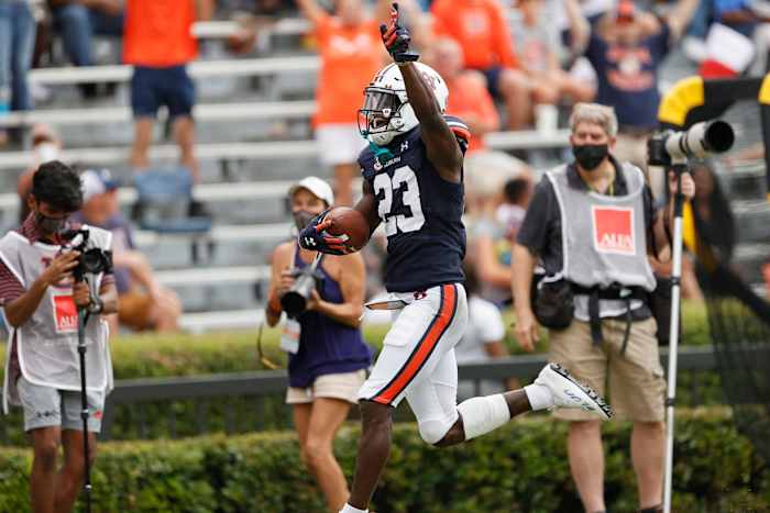 Sep 11, 2021; Auburn, Alabama, USA; Auburn Tigers cornerback Roger McCreary (23) returns an interception for a touchdown during the third quarter against the Alabama State Hornets at Jordan-Hare Stadium. Mandatory Credit: John Reed-USA TODAY Sports